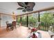 Inviting sunroom featuring a dining area and cozy seating with a beautiful view at 6002 Oak Creek Ln # 1925, Bradenton, FL 34210