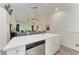 Modern kitchen with white cabinets, a stainless steel dishwasher, and an open floorplan at 6503 Fairway Gardens Dr # 20-201, Bradenton, FL 34203