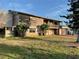 Charming multi-level home featuring a balcony, multiple garage doors, and stone accents at 6907 21St W St, Bradenton, FL 34207