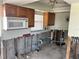 View of a kitchen under renovation, featuring wooden cabinets and modern appliances at 6907 21St W St, Bradenton, FL 34207