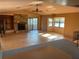 Open living room featuring a stone fireplace, vaulted ceilings, and sliding glass doors to a balcony at 6907 21St W St, Bradenton, FL 34207