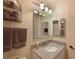 Bathroom featuring granite countertops, stylish mirrors, and decorative towel racks at 6912 Drewrys Blf # 608, Bradenton, FL 34203