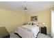 Cozy bedroom with neutral colors, including carpet and light yellow walls at 6912 Drewrys Blf # 608, Bradenton, FL 34203