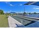 Well-maintained bocce ball court, situated next to a serene lake, perfect for outdoor recreation and leisurely games at 6912 Drewrys Blf # 608, Bradenton, FL 34203