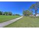 Scenic golf course view with a paved path and lush green grass at 6912 Drewrys Blf # 608, Bradenton, FL 34203