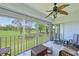 Screened lanai offering serene golf course views and comfortable seating for outdoor relaxation at 6912 Drewrys Blf # 608, Bradenton, FL 34203