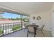 Screened patio area featuring a dining table with chairs, offering outdoor living space at 6912 Drewrys Blf # 608, Bradenton, FL 34203