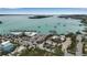 Beautiful aerial view showcases a waterfront building and marina with stunning bay views at 710 Fox St, Longboat Key, FL 34228