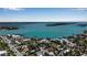 Expansive aerial view of a residential area nestled along the waterfront with boat docks and calm water at 710 Fox St, Longboat Key, FL 34228