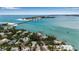 Expansive aerial view of beautiful blue waterways, nearby islands, and luxury bayfront homes at 710 Fox St, Longboat Key, FL 34228