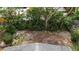 Aerial view of backyard with mature trees and privacy fence at 710 Fox St, Longboat Key, FL 34228