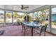 Relaxing screened-in patio with comfortable seating, perfect for enjoying the outdoors at 710 Fox St, Longboat Key, FL 34228
