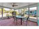 Relaxing screened-in patio with comfortable seating, perfect for enjoying the outdoors at 710 Fox St, Longboat Key, FL 34228