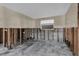 Well-lit room with natural light, ready for renovation with exposed framework and block walls at 710 Fox St, Longboat Key, FL 34228