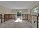 Renovation-ready room with a glass door leading outside and natural light from a window at 710 Fox St, Longboat Key, FL 34228