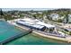 Elegant waterfront building with outdoor dining and serene water views, perfect for a sophisticated lifestyle at 710 Fox St, Longboat Key, FL 34228