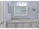 Bathroom features a large vanity, granite counters, and modern lighting at 7112 46Th E Ct, Ellenton, FL 34222