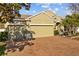 Charming one-story home featuring a brick driveway and a three-car garage at 7112 46Th E Ct, Ellenton, FL 34222