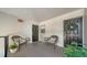 Inviting outdoor seating area with cozy chairs and decor, perfect for relaxing and enjoying the community at 7231 W Country Club N Dr # 231, Sarasota, FL 34243