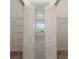 Walk-in closet with open double doors and wire shelving at 7742 Ridgelake Cir, Bradenton, FL 34203