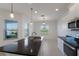Bright kitchen featuring a granite countertop island, stainless steel appliances, and pendant lighting at 7742 Ridgelake Cir, Bradenton, FL 34203