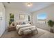 Cozy main bedroom features neutral tones, natural light, and comfortable furniture at 7742 Ridgelake Cir, Bradenton, FL 34203