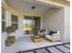 Inviting covered patio with comfortable seating and sliding glass doors to the interior, perfect for relaxing at 7742 Ridgelake Cir, Bradenton, FL 34203