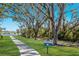 Picturesque walking trail with mature trees, offering a scenic outdoor experience for residents at 7742 Ridgelake Cir, Bradenton, FL 34203