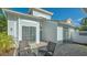 Outdoor patio with seating, overlooking meticulously maintained yard at 7742 Whitebridge Gln, University Park, FL 34201