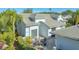 Paver patio features an outdoor seating area surrounded by mature landscaping at 7742 Whitebridge Gln, University Park, FL 34201