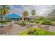 Inviting outdoor seating area with plush wicker furniture, perfect for relaxing and enjoying the beautiful surroundings at 7742 Whitebridge Gln, University Park, FL 34201