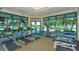 Well-equipped fitness center with treadmills, elliptical machines, and free weights with beautiful views at 7742 Whitebridge Gln, University Park, FL 34201