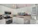 Well-appointed kitchen with stainless steel appliances and ample counter space for cooking at 7742 Whitebridge Gln, University Park, FL 34201