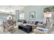 Inviting living room with cozy furniture, natural light, and open-concept design at 7742 Whitebridge Gln, University Park, FL 34201