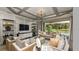 Cozy living room with comfortable seating and decor, and view of backyard at 9128 Radiant Cir, Sarasota, FL 34241