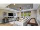 Spacious living room featuring a modern ceiling, entertainment center, and cozy furniture at 9128 Radiant Cir, Sarasota, FL 34241