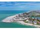 Aerial view showcasing beachfront condo's ideal location near pristine beaches and the blue ocean, with a lovely coastal setting at 100 Sands Point Rd # 225, Longboat Key, FL 34228