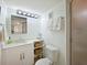 Bright bathroom featuring marble vanity and white cabinetry plus enclosed shower at 100 Sands Point Rd # 225, Longboat Key, FL 34228