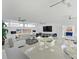 Community clubhouse featuring seating arrangements, decor, and natural light at 100 Sands Point Rd # 225, Longboat Key, FL 34228