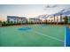 A community basketball court surrounded by lush landscaping and beautiful homes at 12130 Seabrook Ave, Bradenton, FL 34211