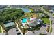 Stunning aerial view of community pool, tennis courts, playground and surrounding lush landscaping at 12130 Seabrook Ave, Bradenton, FL 34211