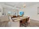 Elegant dining area featuring a wooden table, stylish seating, and plenty of natural light, perfect for Gathering gatherings at 12130 Seabrook Ave, Bradenton, FL 34211