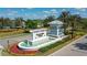 Welcoming entrance to Mallory Park at Lakewood Ranch with decorative sign, landscaping, and water feature at 12130 Seabrook Ave, Bradenton, FL 34211