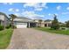 Beautiful home with a well-kept lawn, a two-car garage, and a screened-in porch at 12130 Seabrook Ave, Bradenton, FL 34211