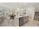 Bright kitchen with granite countertops, stainless steel appliances, and an open layout, seamlessly connected to the dining area at 12130 Seabrook Ave, Bradenton, FL 34211
