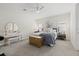 Serene main bedroom with neutral tones, a comfortable bed, and decorative trunk at 12130 Seabrook Ave, Bradenton, FL 34211