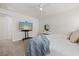 Bright main bedroom with a comfortable bed, flat screen, and decorative chest at 12130 Seabrook Ave, Bradenton, FL 34211