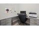 Bright office space with gray cabinets, gold hardware, and a gray, white, and black marble countertop at 12130 Seabrook Ave, Bradenton, FL 34211