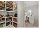 A walk-in pantry with ample shelving and storage space plus dinette area at 12130 Seabrook Ave, Bradenton, FL 34211