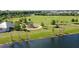 Community park with picnic pavilion, playground, and walking path, complemented by a tranquil pond at 12130 Seabrook Ave, Bradenton, FL 34211